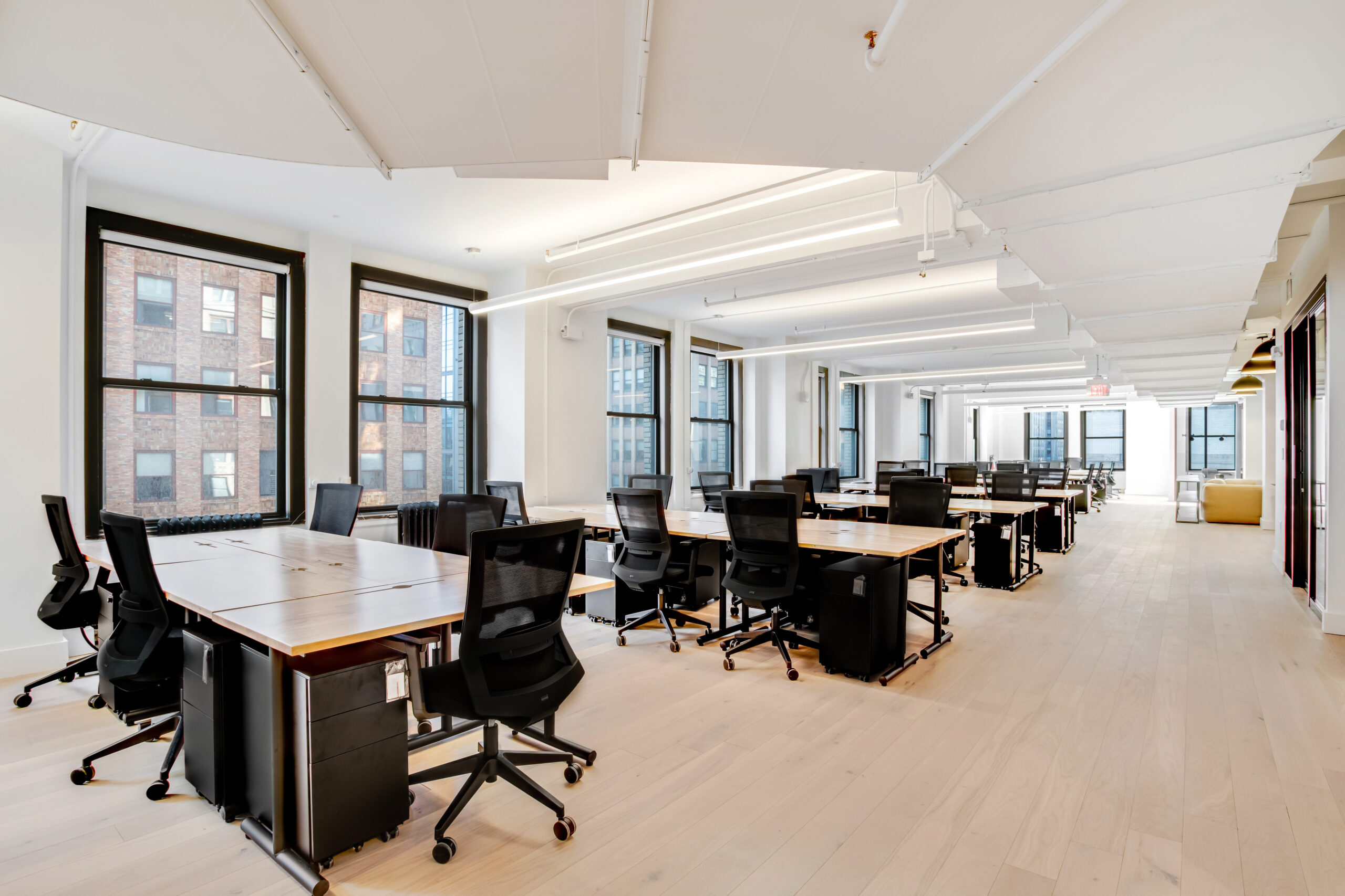wework open working space with tables 185 Madison